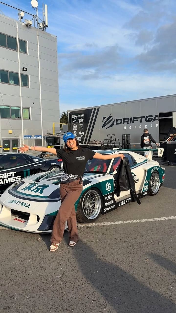 Bruna Villalva beside a Liberty Walk drift car